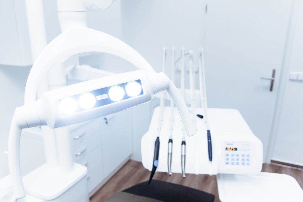 pexels photo 305567 Bright and clean modern dental clinic room with advanced dental equipment.